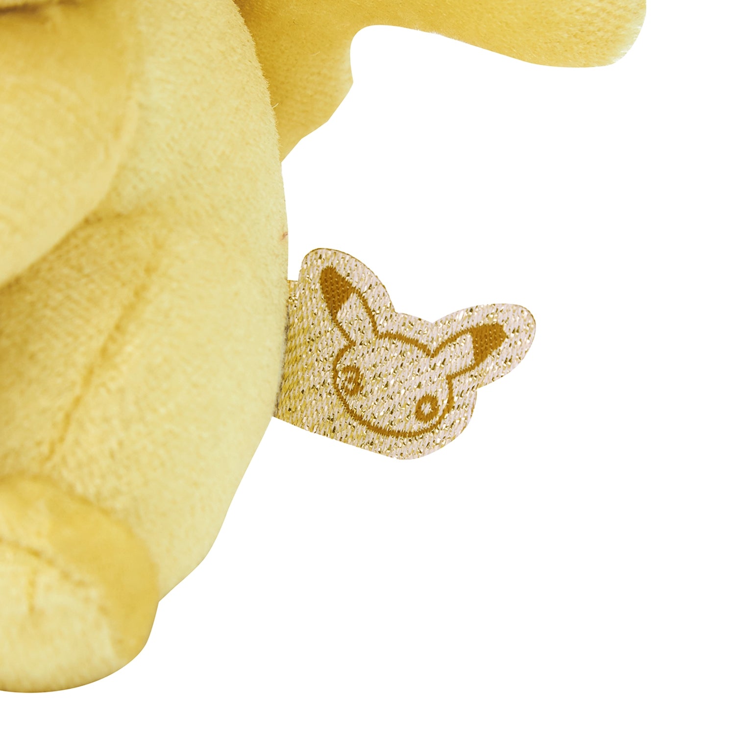 Charm peluche Pikachu “30th” con tonos cálidos y moño naranja, súper adorable para tu día a día. En Nagomi Papelería, papelería japonesa en España.