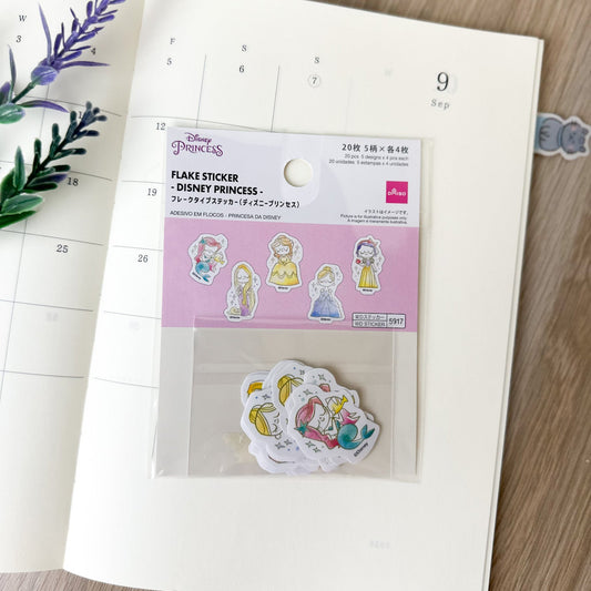 Pack de pegatinas japonesas tipo flake sticker de Princesas Disney sobre agenda abierta